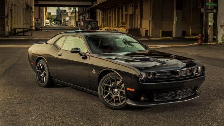 Black Dodge Challenger in Urban Area wallpaper