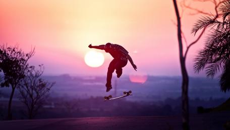 Skateboarder Silhouette at Sunset Adventure wallpaper
