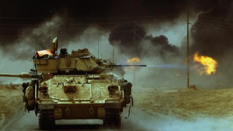 Tank Advancing Through Battlefield with Flames and Smoke wallpaper