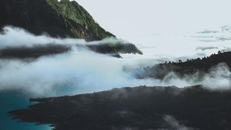 Serene Mountain Landscape with Misty Clouds wallpaper