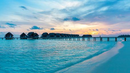 Tranquil Overwater Bungalows at Sunset wallpaper