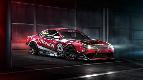 Dynamic Racing Car in Urban Setting wallpaper