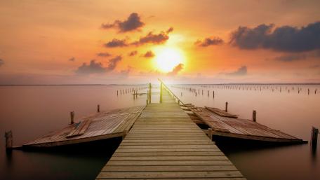Serene Sunset Over Tranquil Pier wallpaper