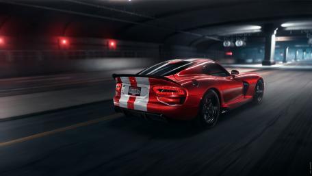 Sleek Red Sports Car on the Move wallpaper