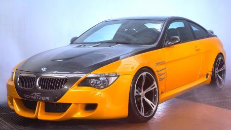 Dynamic BMW Coupe in Striking Yellow and Black Finish wallpaper