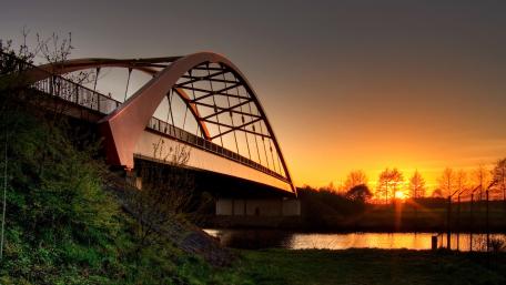 Serene Sunset Over a Daring Bridge wallpaper
