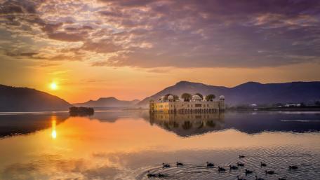 Serene Waters at Dusk with Majestic Castle View wallpaper