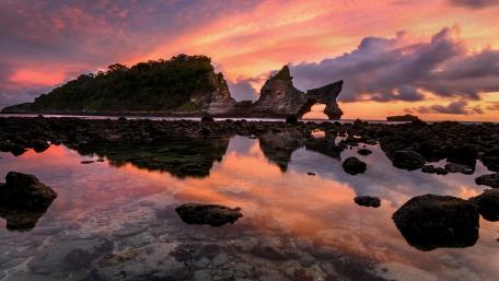Majestic Sunset Over Serene Coastal Landscape wallpaper