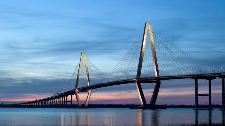 Elegant Bridge at Dusk over Water Surrounded by Serenity wallpaper