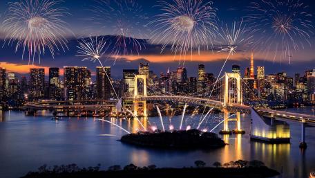 Stunning Night View of a City Celebration with Fireworks wallpaper