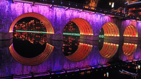 Vibrant Nightscape of Illuminated City Bridge wallpaper