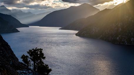 Serene Lake at Dusk with Majestic Mountains wallpaper
