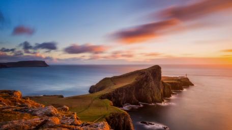 Majestic Coastal Sunset Over Serene Waters wallpaper