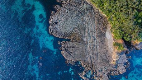 Serene Coastal Landscape with Vibrant Waters wallpaper
