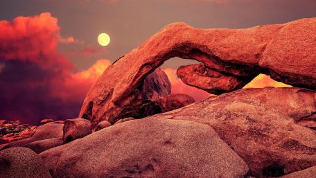 Majestic Rock Arch Under Moonlit Sky wallpaper
