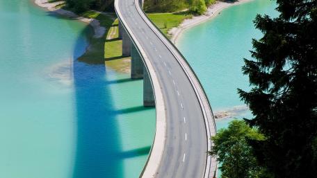 Curved Bridge Over Turquoise Waters wallpaper