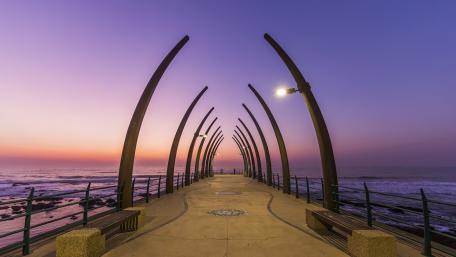 Serene Sunset Over Coastal Pier wallpaper