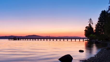 Tranquil Sunset Over Serene Waterway wallpaper