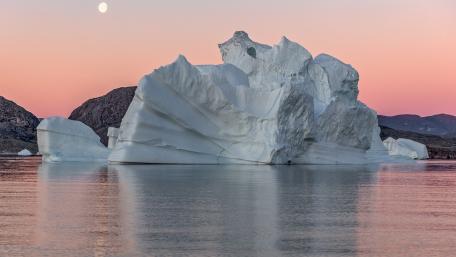 Majestic Iceberg Under a Tranquil Moonlight Sky wallpaper