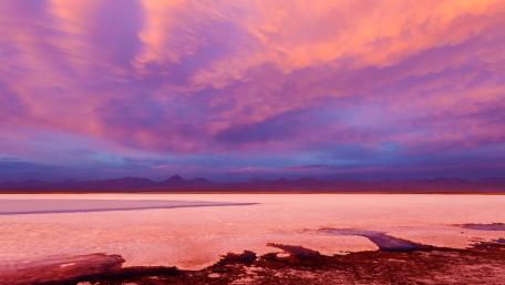 Vibrant Sunset Over a Salt Flat Landscape wallpaper
