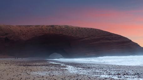 Serene Coastal Sunset Over Rocky Archway wallpaper