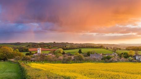 Serene Sunset Over Rolling Hills wallpaper