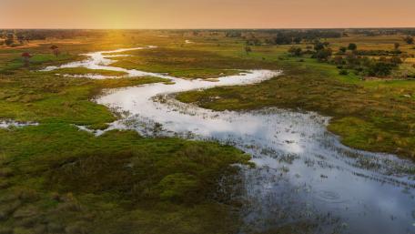 Serene Landscape at Sunset Over Riverbend wallpaper