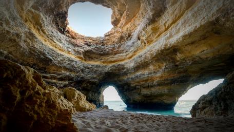 Cave Oasis by the Ocean's Edge wallpaper