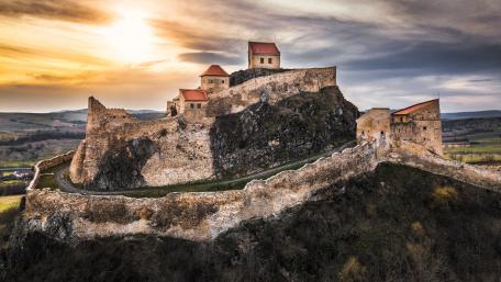 Majestic Fortress on a Hilltop at Sunset wallpaper