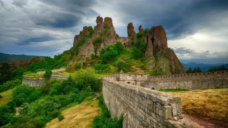 Ancient Fortress Against Stormy Sky wallpaper