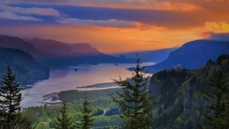 Breathtaking Sunset Over Serene River Landscape wallpaper