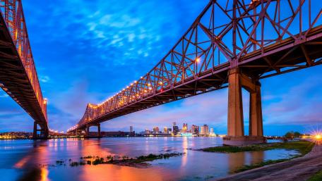 Vibrant City Skyline Under a Stunning Bridge wallpaper