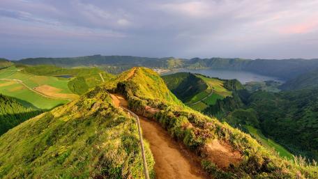 Majestic Green Hills and Serene Lake Views wallpaper