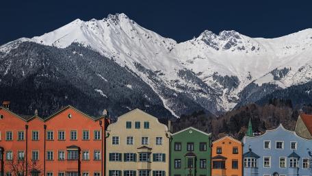 Charming Cityscape Against Majestic Mountains wallpaper