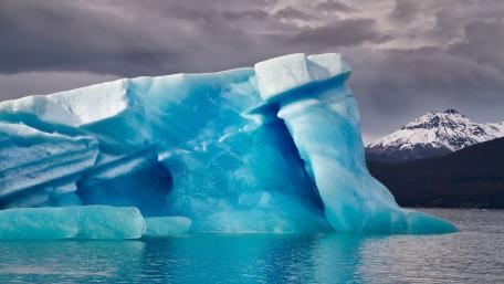 Majestic Iceberg Against a Stormy Sky wallpaper