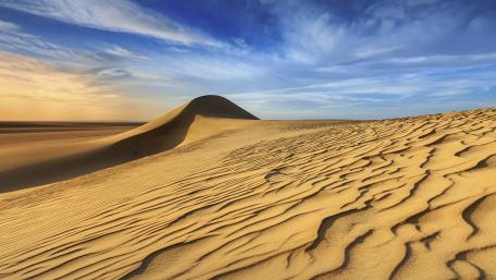 Golden Sand Dunes Under a Vast Sky wallpaper