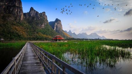 Serene Nature Retreat with Mountains and Waterway wallpaper