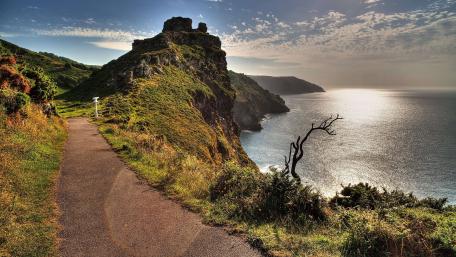 Serene Coastal Pathway Under a Majestic Sky wallpaper
