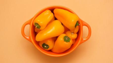 Vibrant Yellow Peppers in a Bowl wallpaper