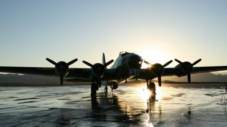 Majestic Bomber Silhouette at Sunset wallpaper
