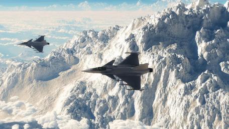Fighter Jets Soaring Over Majestic Mountains wallpaper