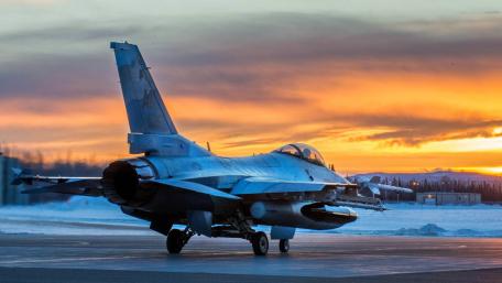 Fighter Jet at Sunset with Vibrant Skies wallpaper
