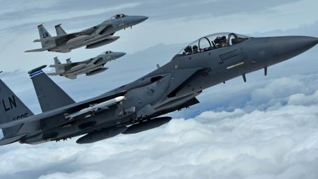 Fighter Jets in Formation Above the Clouds wallpaper