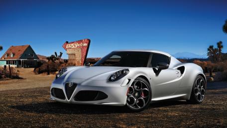 Sleek Silver Sports Car in Desert Landscape wallpaper