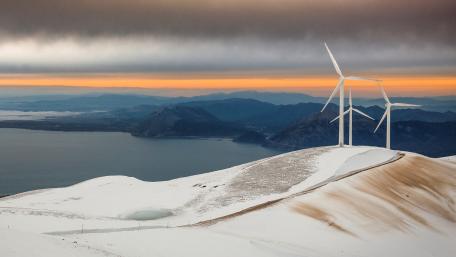 Majestic Wind Turbines in Snowy Landscape wallpaper