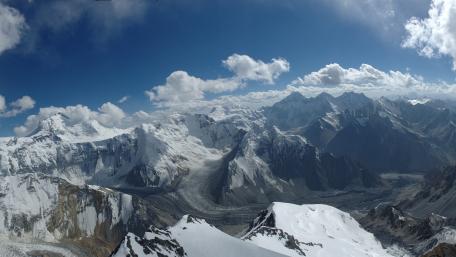 Majestic Snow-Capped Peaks Above the Clouds wallpaper