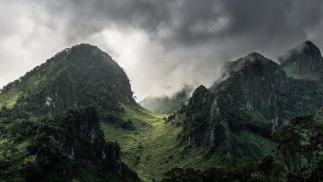 Majestic Mountains Under Dramatic Clouds wallpaper