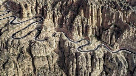 Winding Road Through Majestic Rock Formations wallpaper