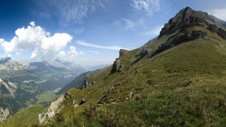 Majestic Mountains Under a Clear Blue Sky wallpaper
