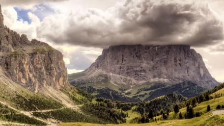 Majestic Mountain Landscape Under Dramatic Skies wallpaper
